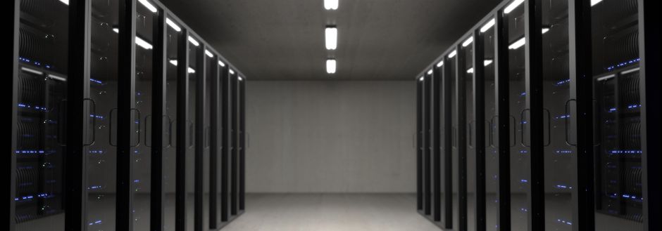 Server room with rows of illuminated data storage systems