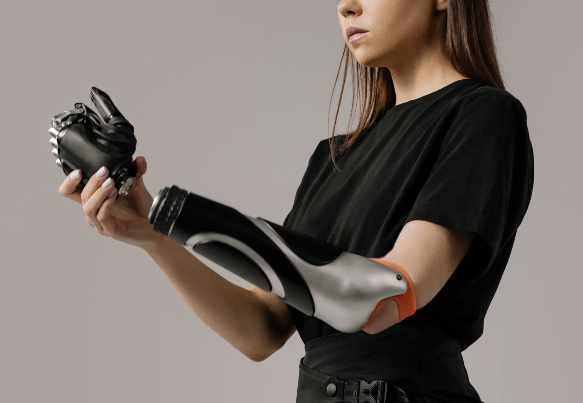 Young woman with a modern prosthetic arm showcasing advanced technology.